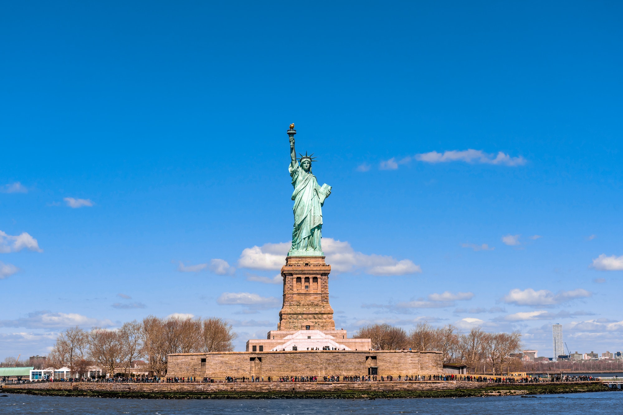 The Statue Of Liberty Under The Blue Sky Background Lower Manhattan New York City